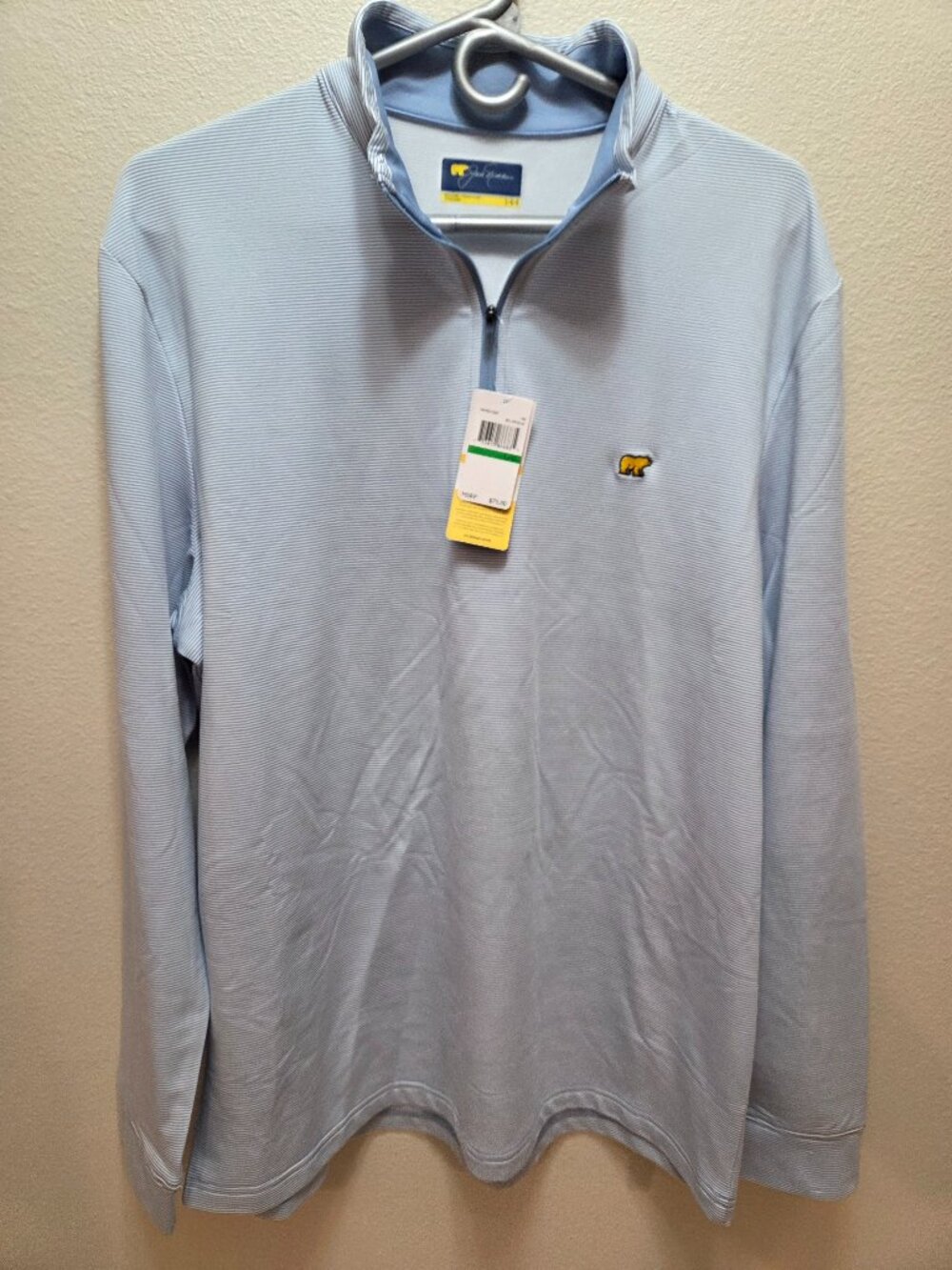Light blue Jack Nicklaus quarter-zip golf pullover featuring the signature logo